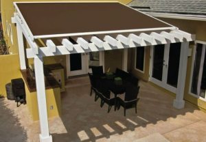 Striped commercial awnings being installed in a shop.