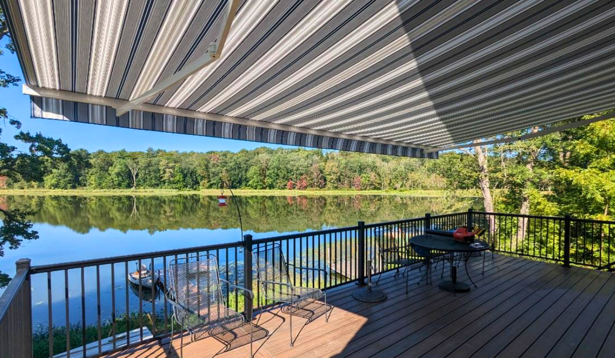 A professional doing custom awning installation for a home in Ohio.